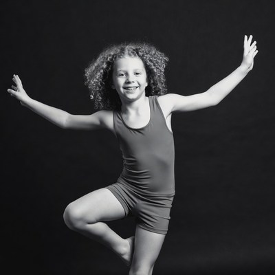 Curly-haired girl doing yoga pose