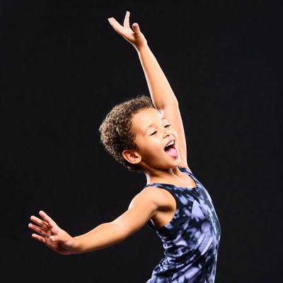 Boy dancing with arms raised