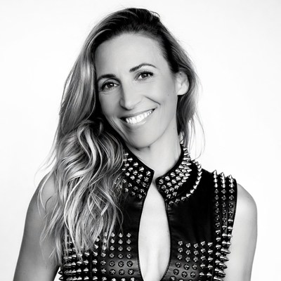 Smiling woman in studded leather vest