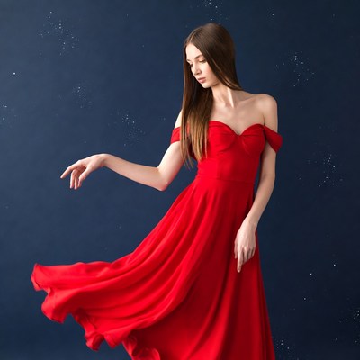 Woman in red dress with starry background