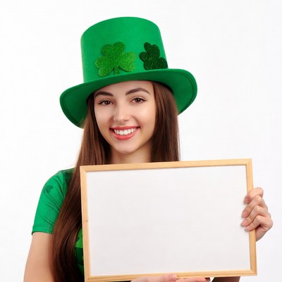 Woman in green leprechaun hat holding blank sign