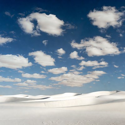 White Sand Dunes Under Blue Sky