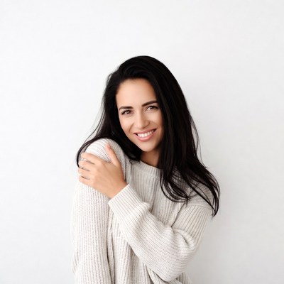 Smiling woman in white sweater