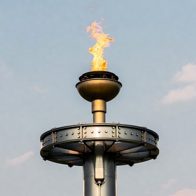 Flaming Olympic Torch on Pedestal