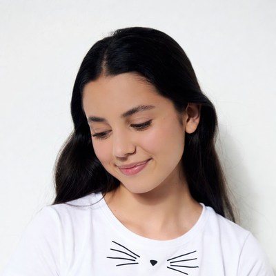 Girl smiling in cat face t-shirt