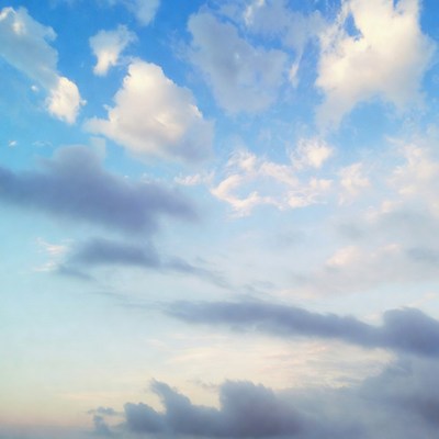 Fluffy White Clouds in Blue Sky