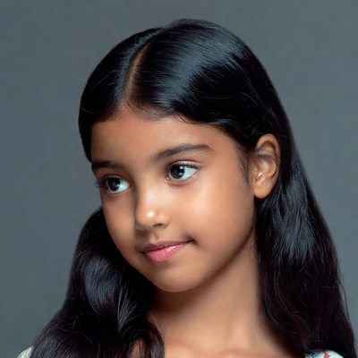 Indian girl smiling profile view