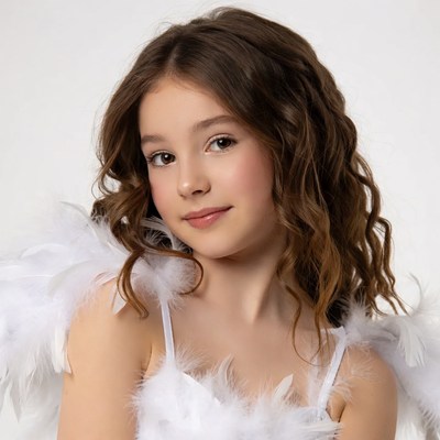 Girl in white feathered wings