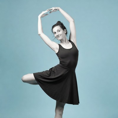 Ballerina in black tutu pose