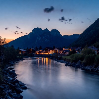 Mountain Village by River at Twilight