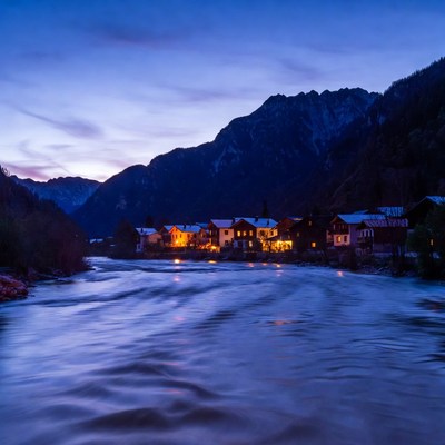 Alpine Village at Twilight by River