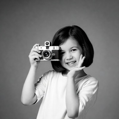 Girl holding vintage camera
