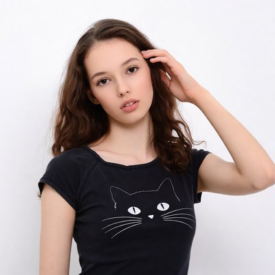 Young woman in cat t-shirt touching hair
