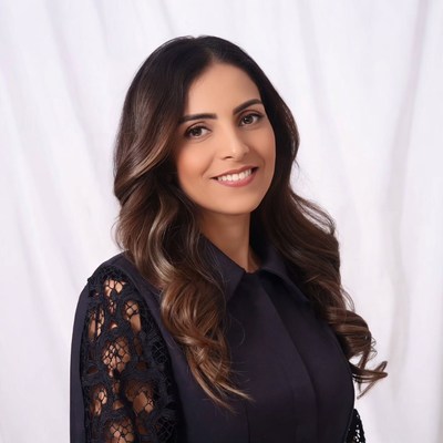 Smiling woman with long wavy hair
