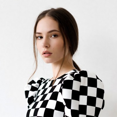 Woman in checkered puff sleeve top