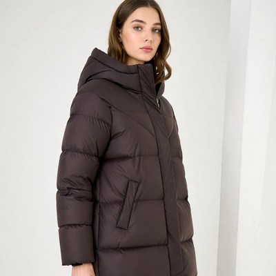 Woman wearing maroon hooded puffer jacket