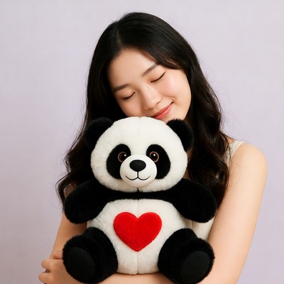 Asian woman hugging plush panda