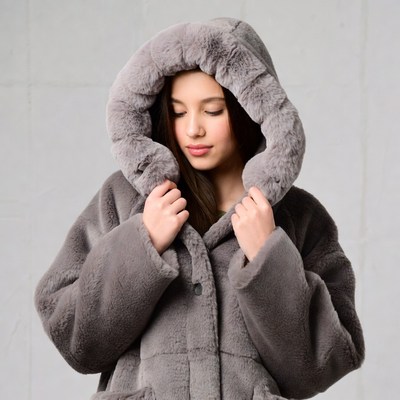 Girl in gray faux fur hooded jacket