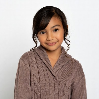 Smiling Asian girl in brown sweater