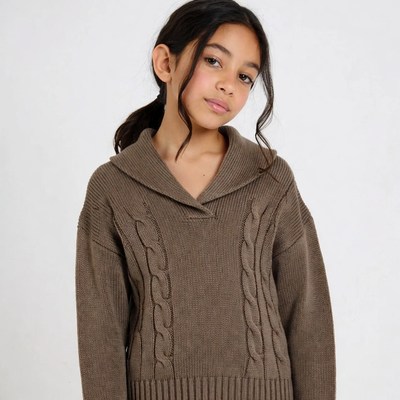 Girl in brown cable knit sweater