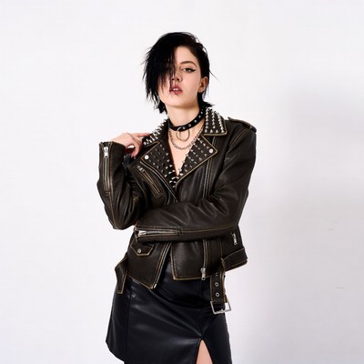 Woman in studded leather jacket