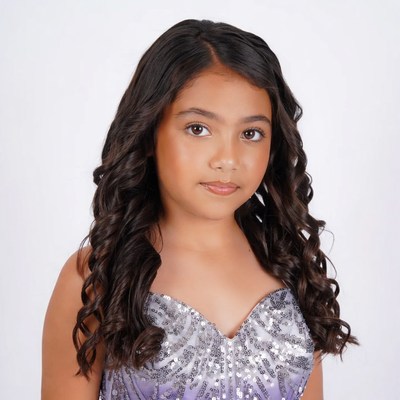 Young Latina girl in sparkly dress