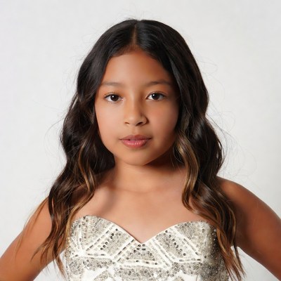 Young girl in sparkling strapless dress