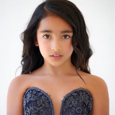 Young Asian girl in navy lace dress