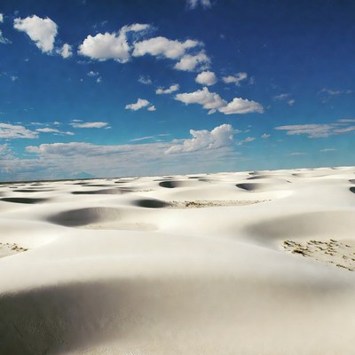 White Sand Dunes Under Blue Sky