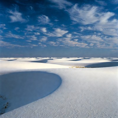 White Sand Dunes Under Blue Sky