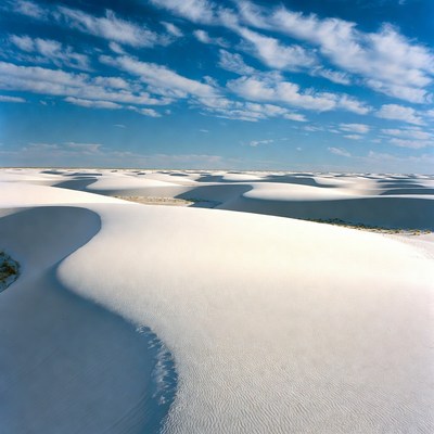 White Sand Dunes Under Blue Sky