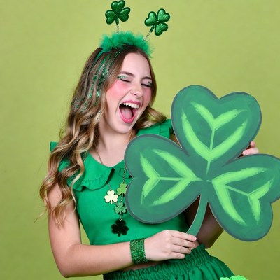 Girl holding large shamrock St. Patrick's Day