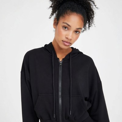 African-American woman in black hoodie