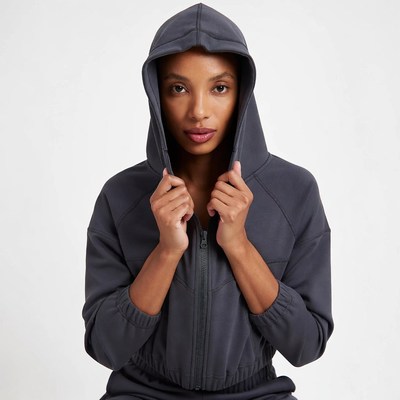 African-American woman in gray hoodie