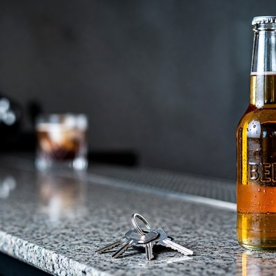 Beer Bottle with Keys and Whiskey Glass
