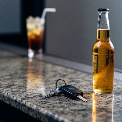 Beer Bottle and Car Keys on Bar