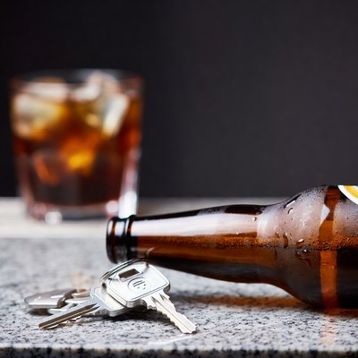 Beer Bottle and Car Keys on Table