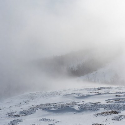 Snowy Mountain Landscape in Fog