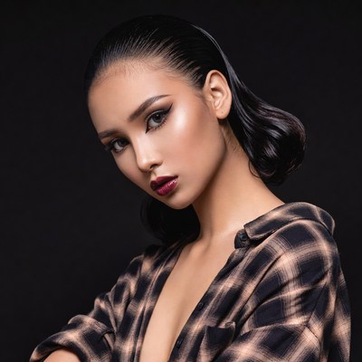 Asian woman in plaid shirt portrait