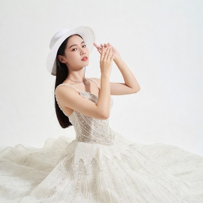 Asian woman in beaded gown with hat