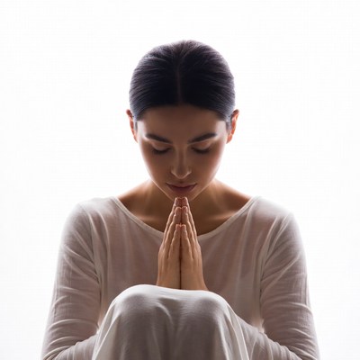 Asian woman praying hands silhouette