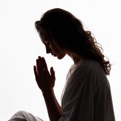 Woman praying silhouette