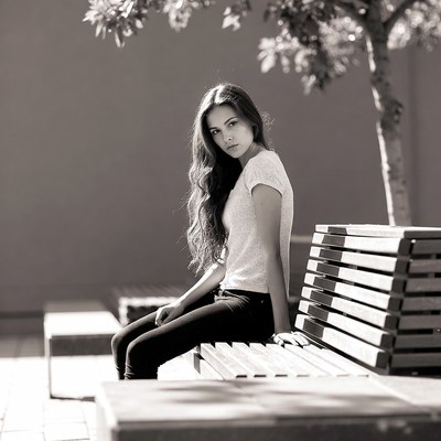 Young woman sitting on bench