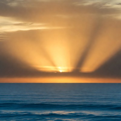 Sun rays over ocean sunset