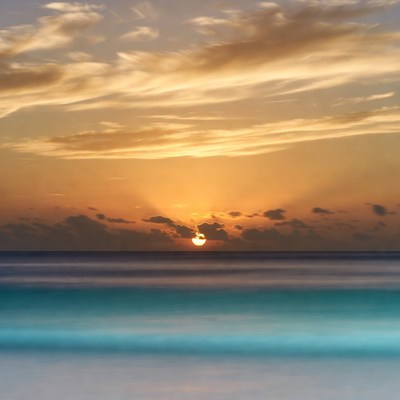 Sunset over turquoise ocean