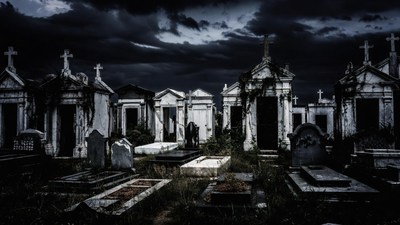 Spooky Cemetery with Tombs and Crosses