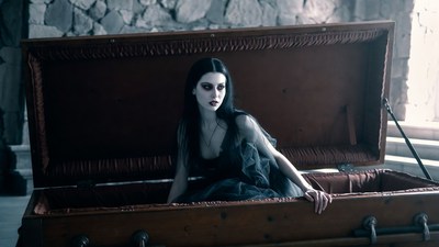 Vampire woman in open coffin