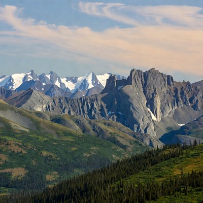 Snowy Mountain Range with Green Valleys