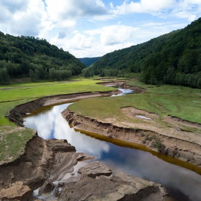 Winding River in Forest Valley