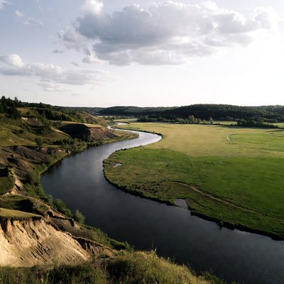Winding River Through Green Valley